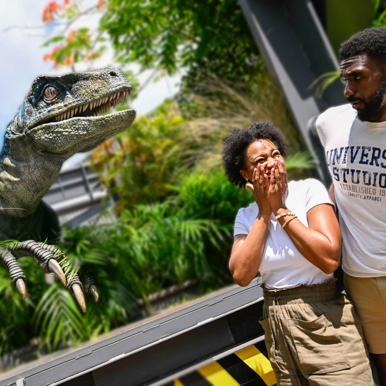 Two Guests facing each other, one laughing and the other looking worried, as Blue the velociraptor looms nearby.