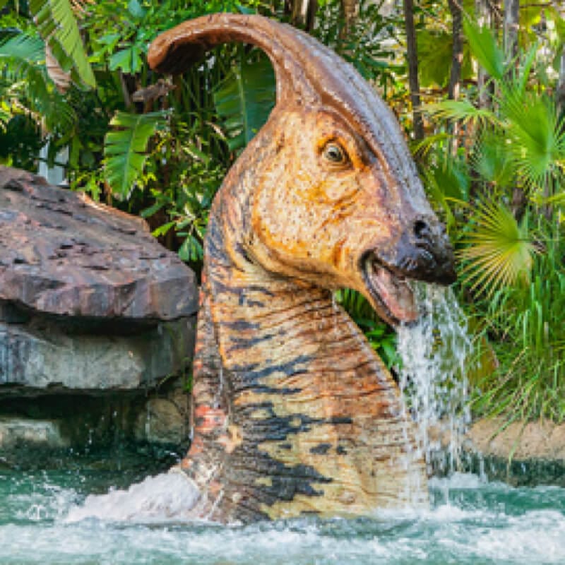Jurassic Park River Adventure Fast Fact image 1, a dinosaur poking its head out of the water