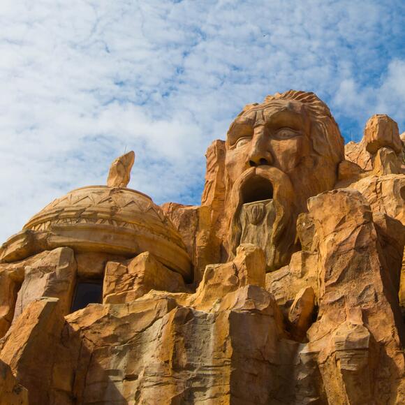 A face shows in the towering rock formations outside Mythos Restaurant at Universal's Islands of Adventure.