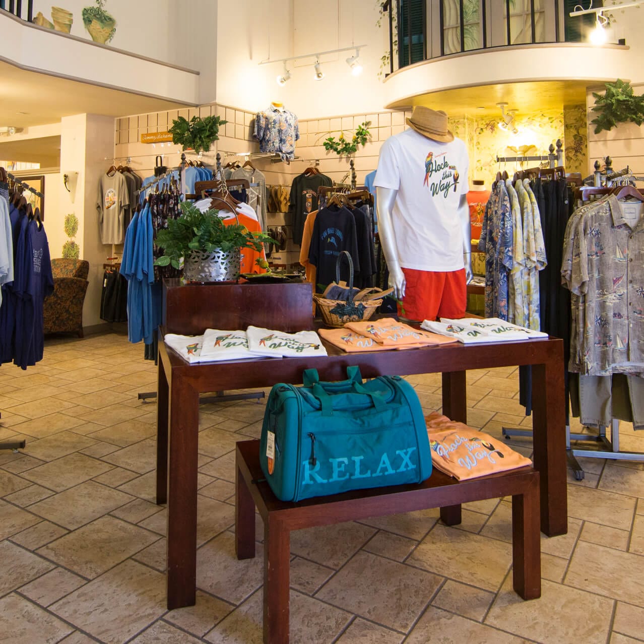 Tees, hats, sunglasses and other types of vacation wear on display Le Memories de Portofino gift shop at Universal Orlando.