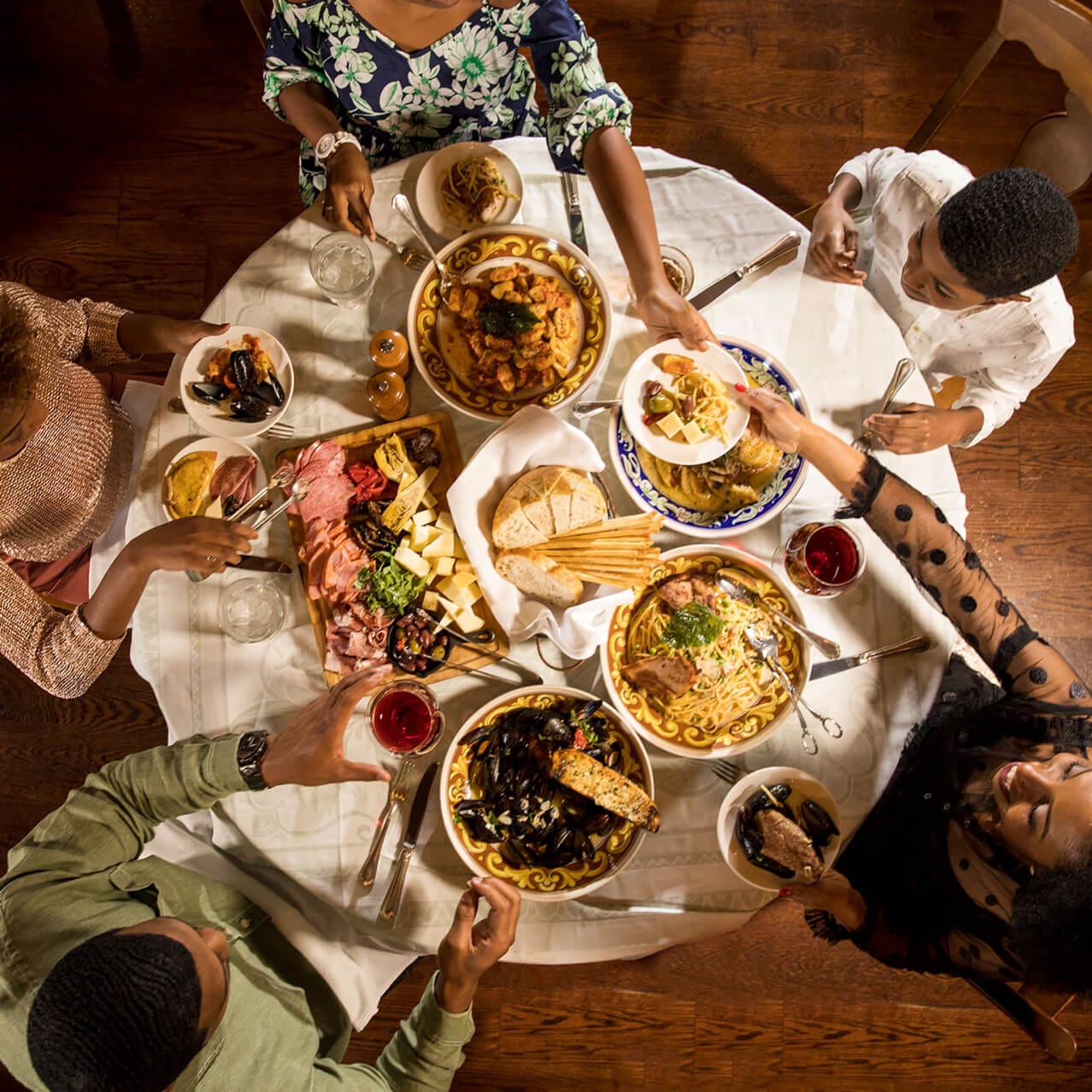 An overhead view of a family enjoying an Italian meal at Mama Della's Ristorante at Portofino Bay Hotel at Universal Orlando Resort.