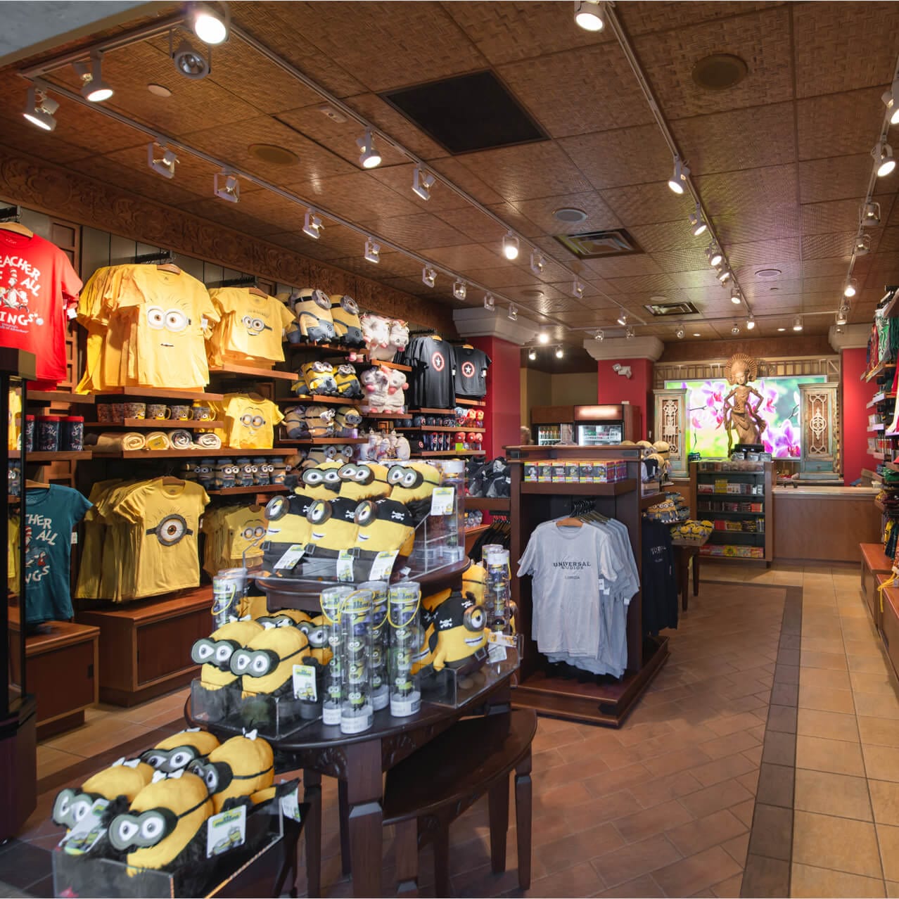 The interior of Toko Gifts at Loews Royal Pacific Resort shows T shirts, water bottles, and other merchandise on display.