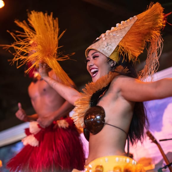 Dancers perform a Polynesian dance during the Wantilan Luau at Loews Royal Pacific Resort in Universal Orlando.