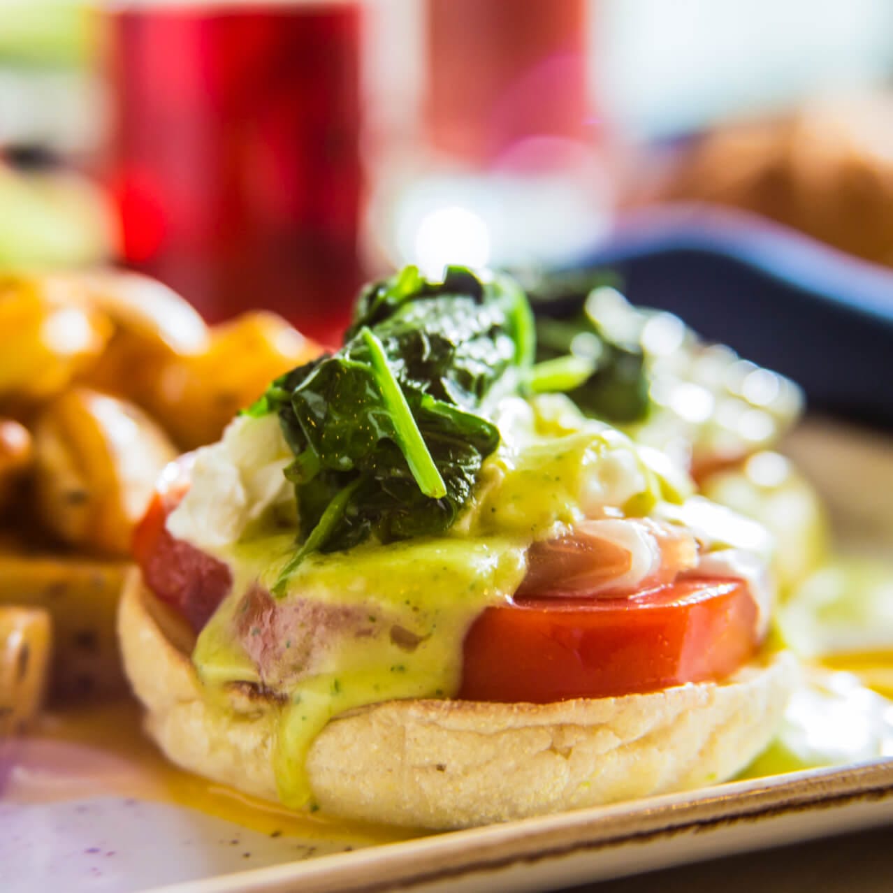 An English muffin with a delicious topping is on display at Loews Sapphire Falls signature restaurant, Amatista Cookhouse.