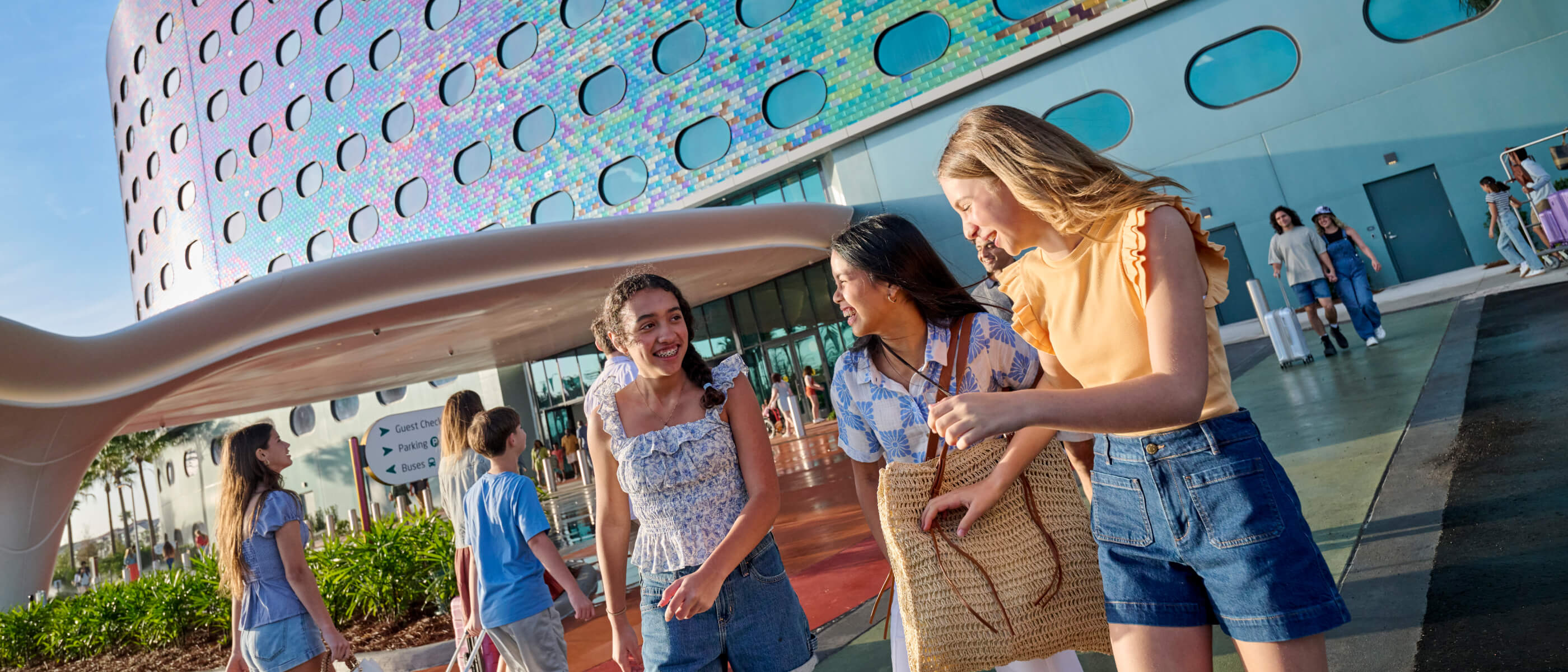 People walking near the front entrance of Universal Terra Luna Resort.