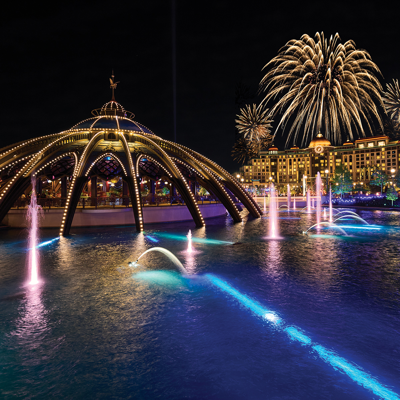 Fireworks, illuminated fountains, and glowing architecture during the Celestial Goodnight nighttime show at Universal Epic Universe.