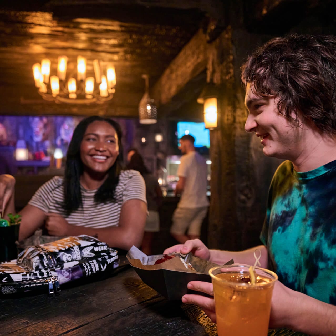 Guests dining in the Burning Blade Tavern, with specialty drinks and Vampire inspired entrees.