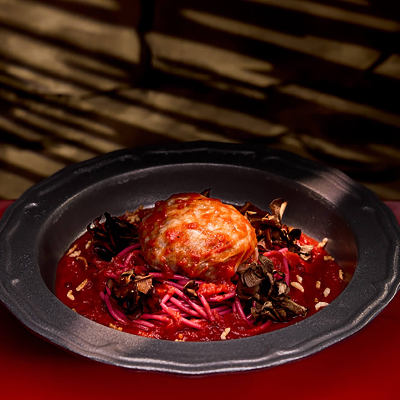 Our Favorite Vegan Familiar’s Stuffed Cabbage is a vegan meat wrapped in cabbage leaves in a pepper tomato sauce, served at Das Stakehaus in Dark Universe.