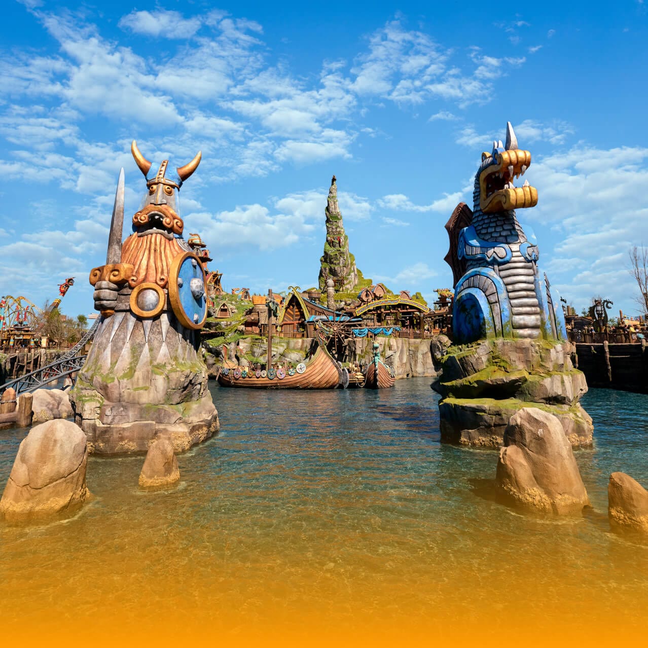 How to Train Your Dragon - Isle of Berk with Viking and dragon sentry statues, dragon houses, and Mead Hall rising in the distance.