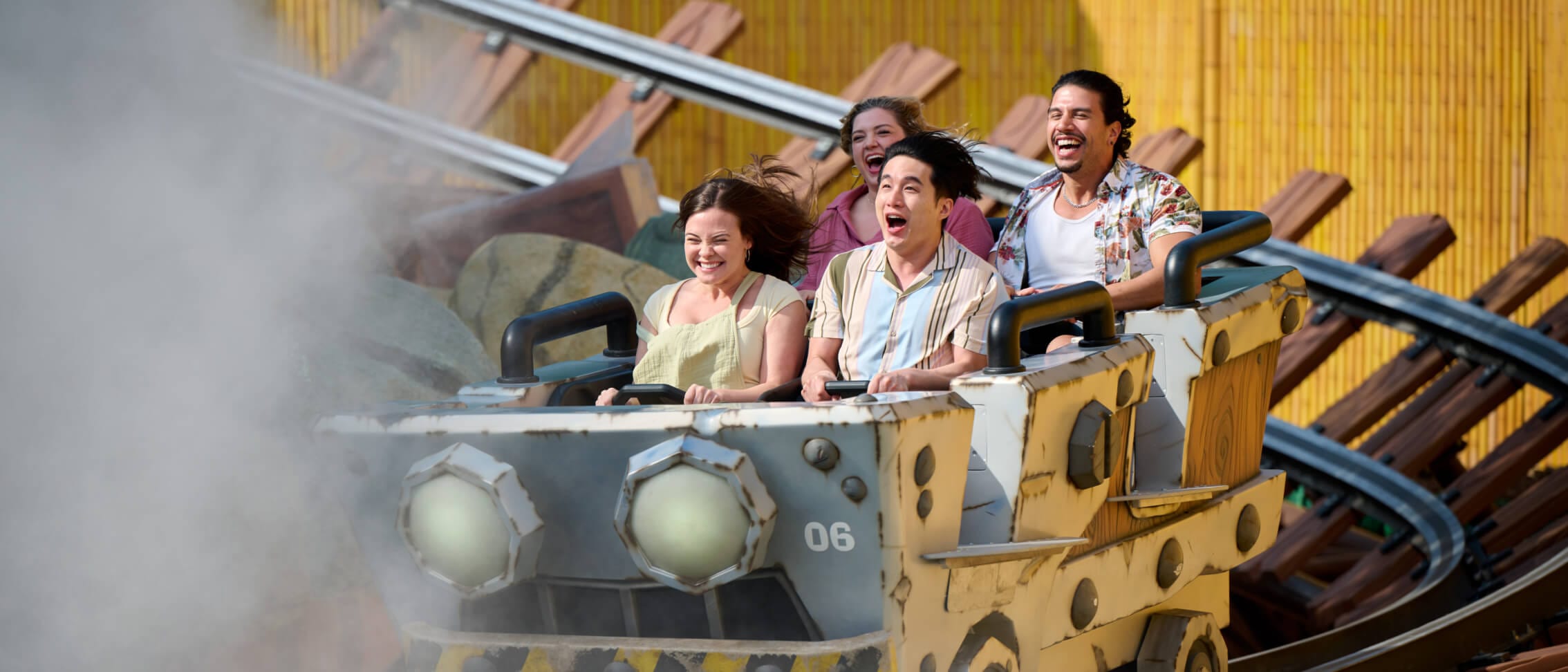 Riders laugh as they enjoy the thrilling Mine-Cart Madness™ family coaster, in Donkey Kong Country at SUPER NINTENDO WORLD™.