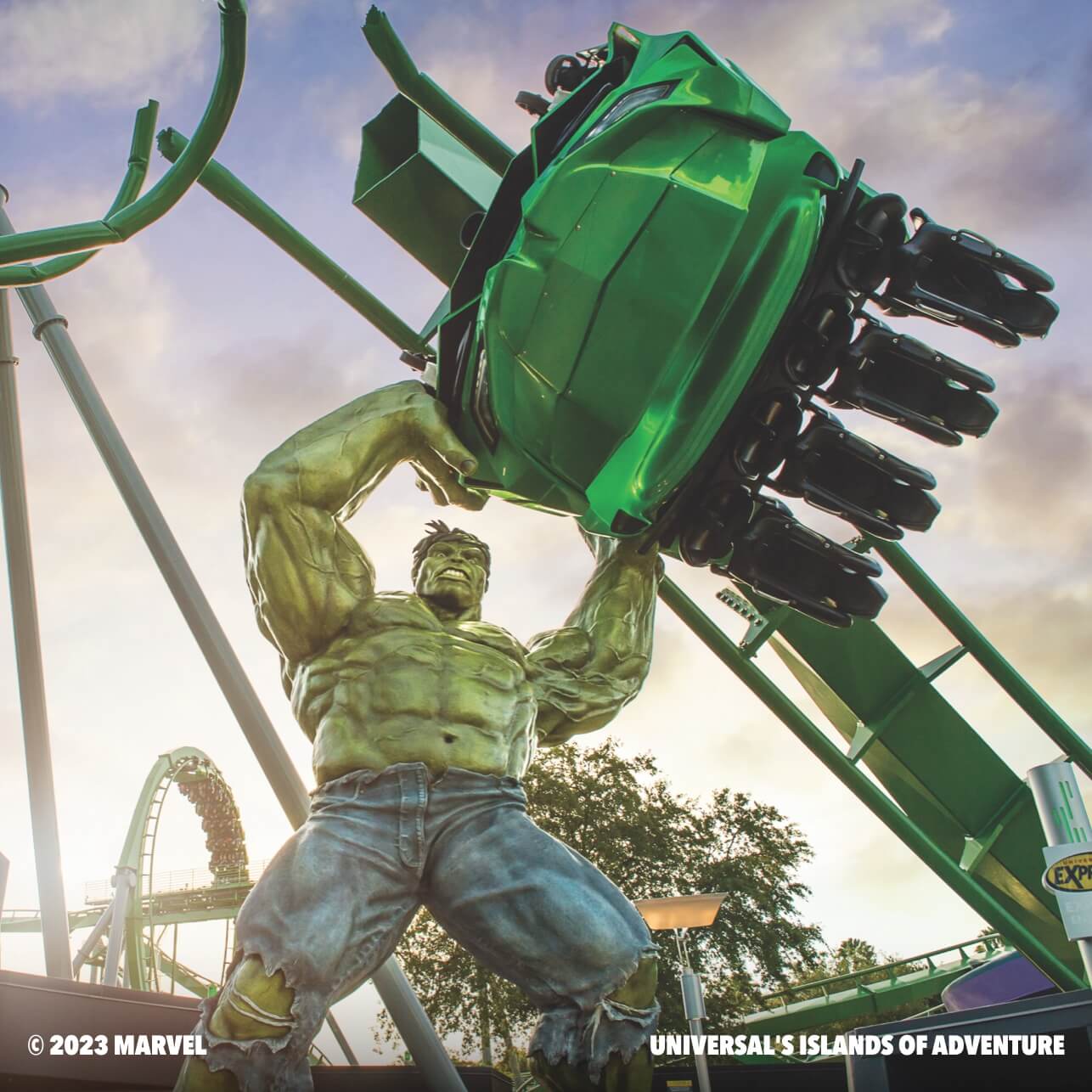 An animated Incredible Hulk lifting up a roller coaster car.