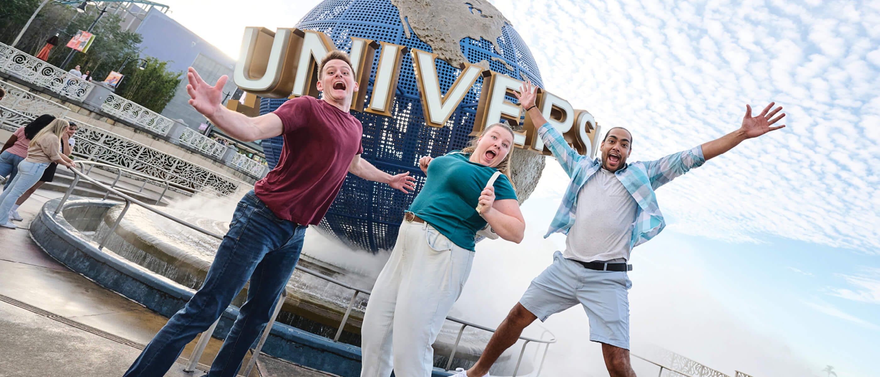 Three friends posing for a selfie with the Pharaohs in front of Revenge of the Mummy at Universal Studios Florida.