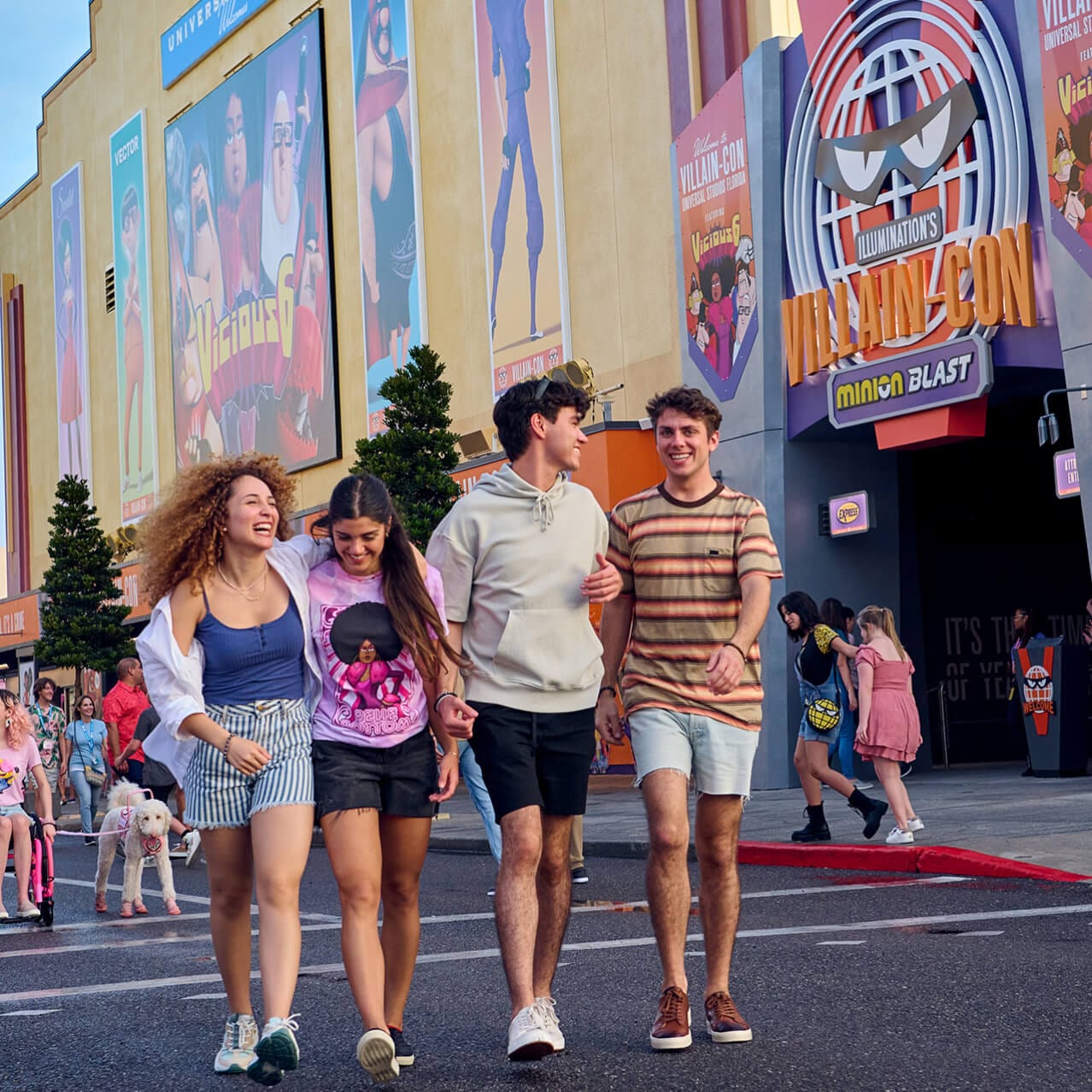 A group of teen friends outside of the entrance to Illumination’s Villain-Con Minion Blast attraction at Universal Studios Florida.