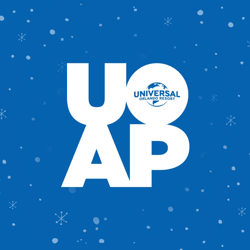 White Universal Orlando Annual Passholder logo on a snowy blue background.