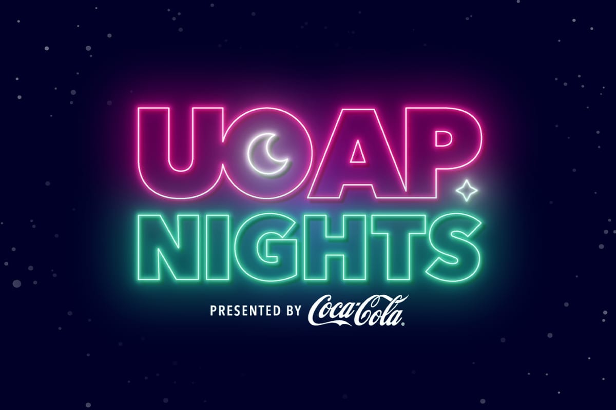 Pink and green neon letters spelling “UOAP NIGHTS,” with “PRESENTED BY Coca-Cola” below, on a dark starry background.