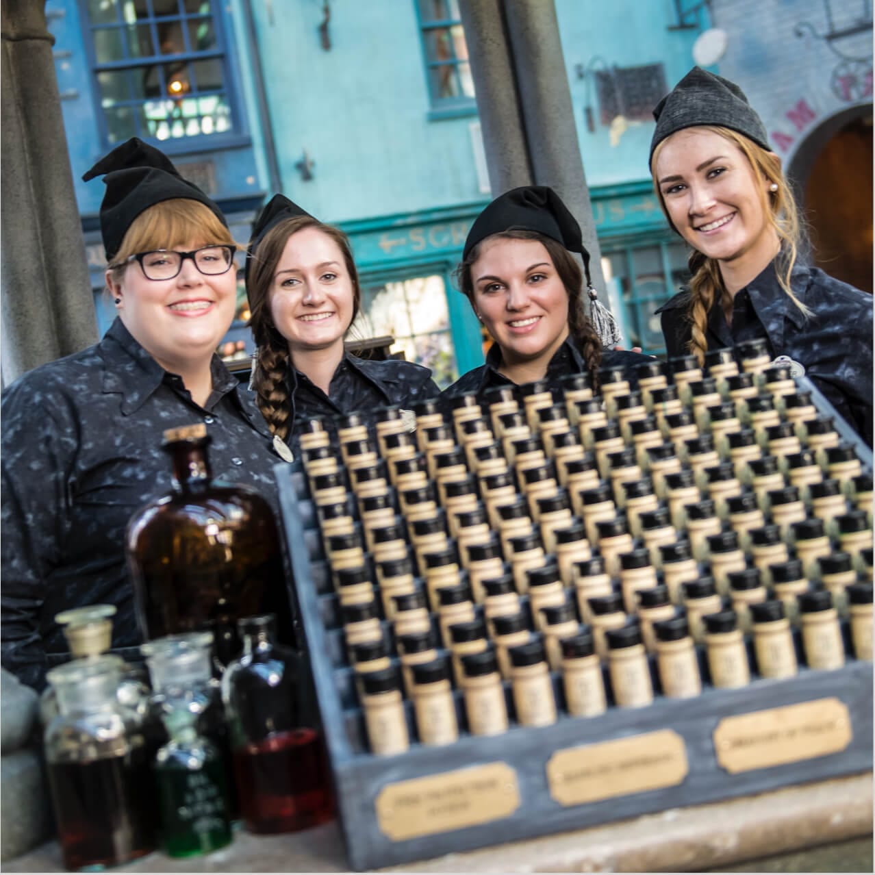 Friendly staff at Eternelle's Elixir of Refreshment, a magical beverage stand in Diagon Alley at Universal Studios Orlando.