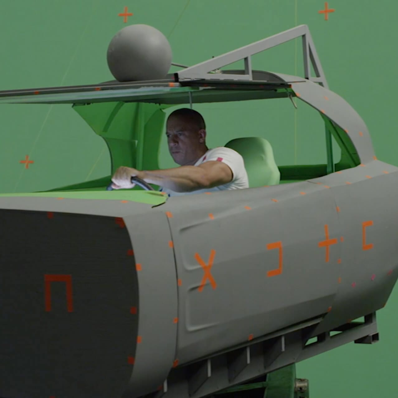 Vin Diesel films against a green screen for the Behind the Scenes video reel