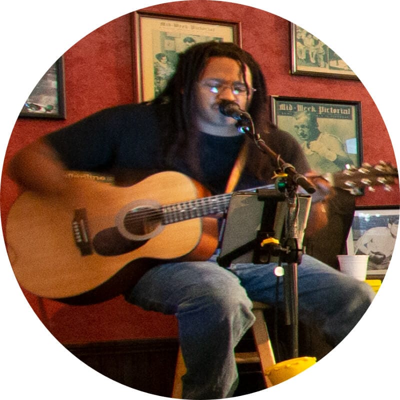 A singer plays guitar at Finnegan's Bar and Grill in Universal Studios Orlando.