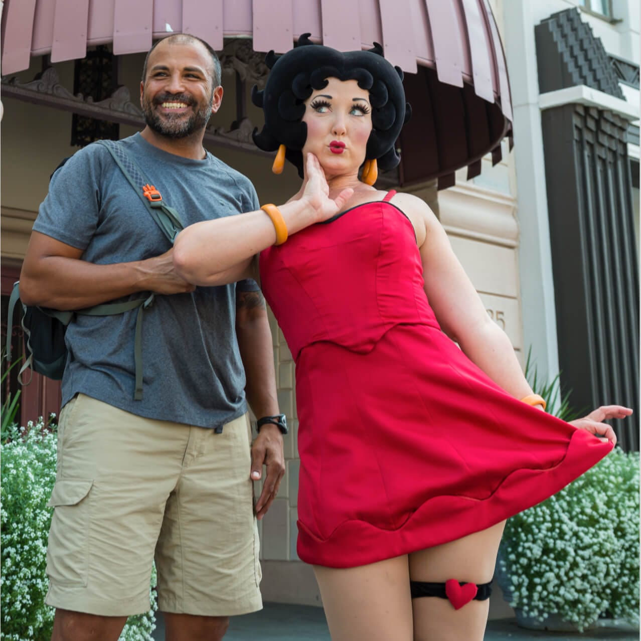 A park guest smiles as he poses for a photo with Betty Boop, one of the stars that you can encounter at Universal Studios Orlando in the Hollywood Character Zone.