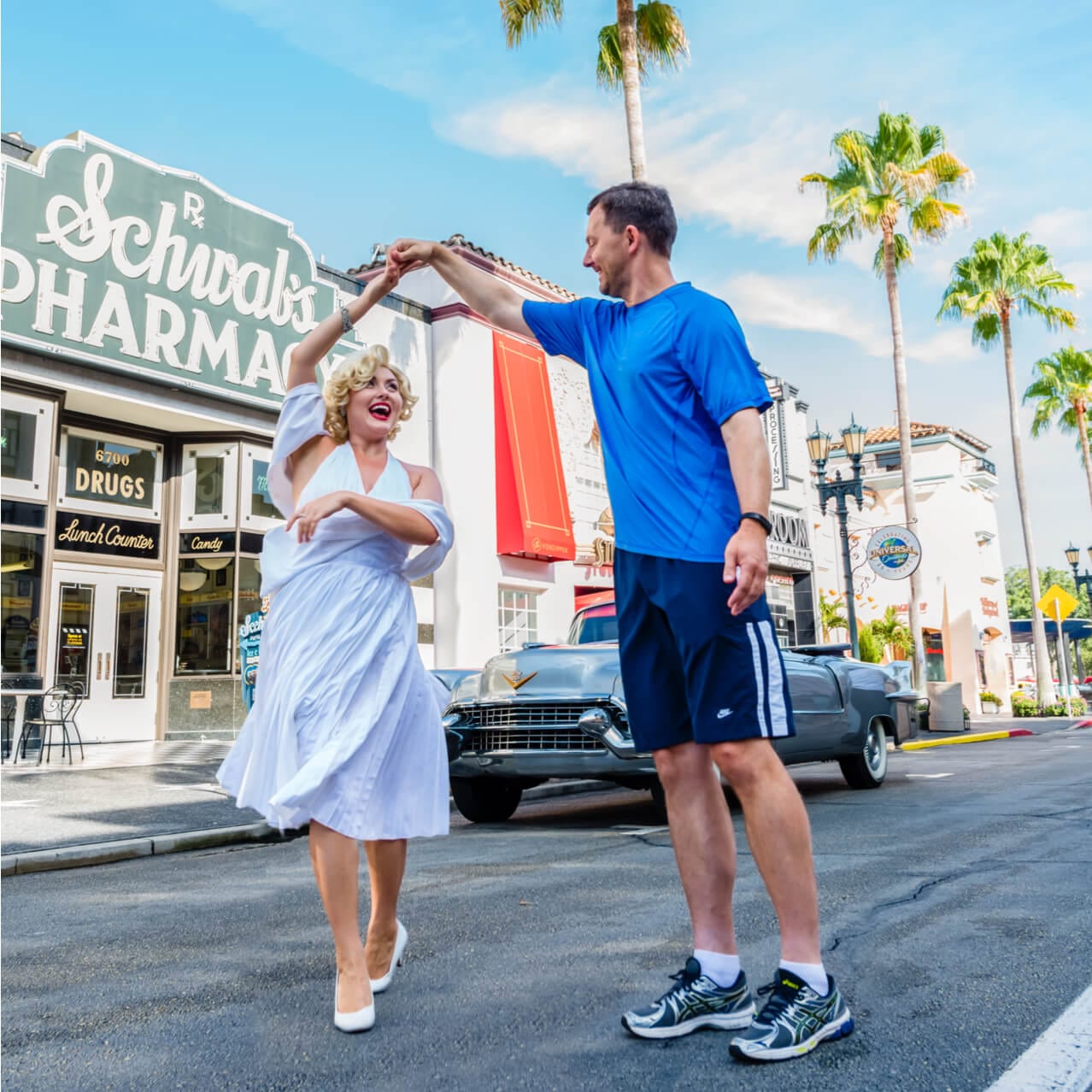 A park guest twirls Marilyn Monroe while dancing with her in the streets of the Hollywood Character Zone at Universal Studios Orlando.