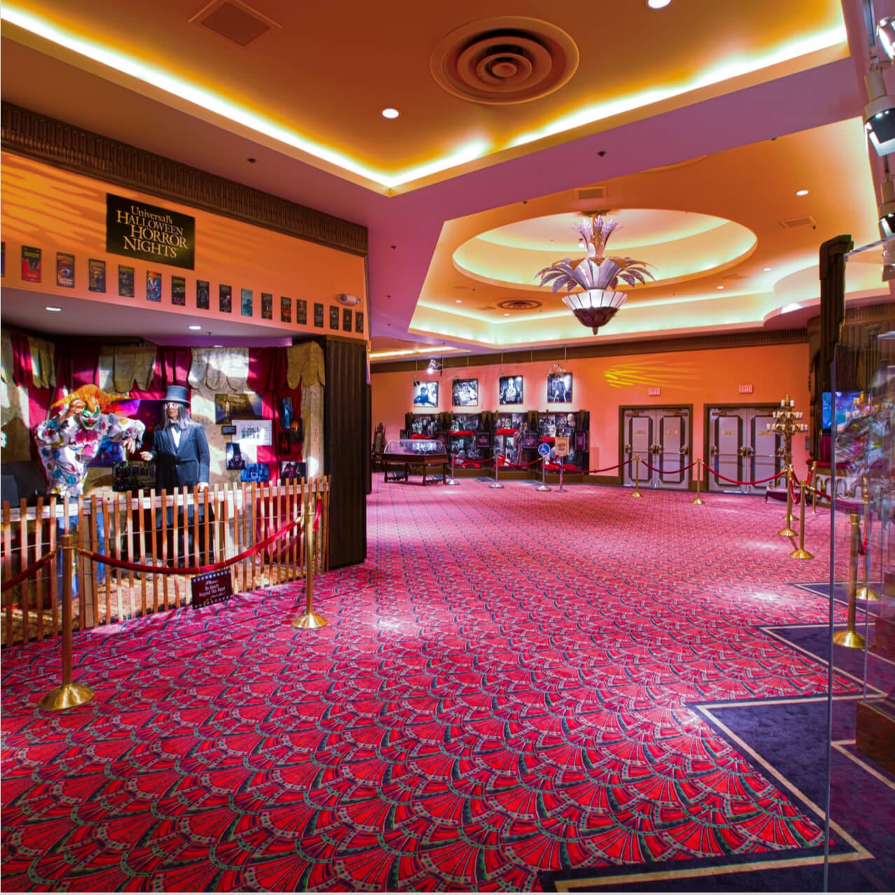 The lobby of Universal Orlando's Horror Make Up Show displays props and memorabilia from some spooky films and events.