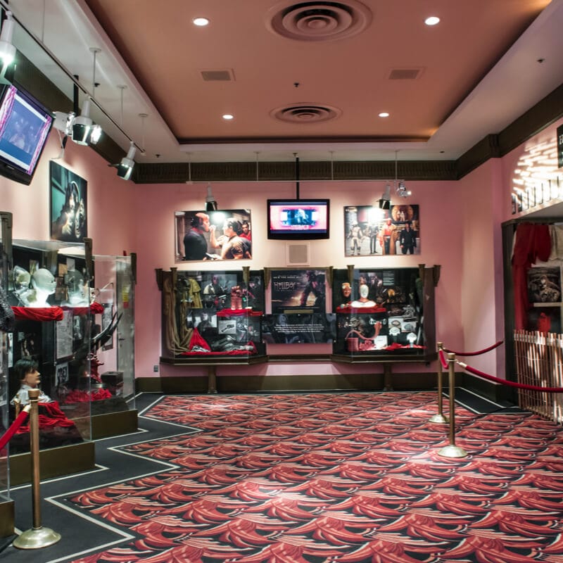 Universal Orlando’s Horror Make Up Show’s lobby display of props and memorabilia.