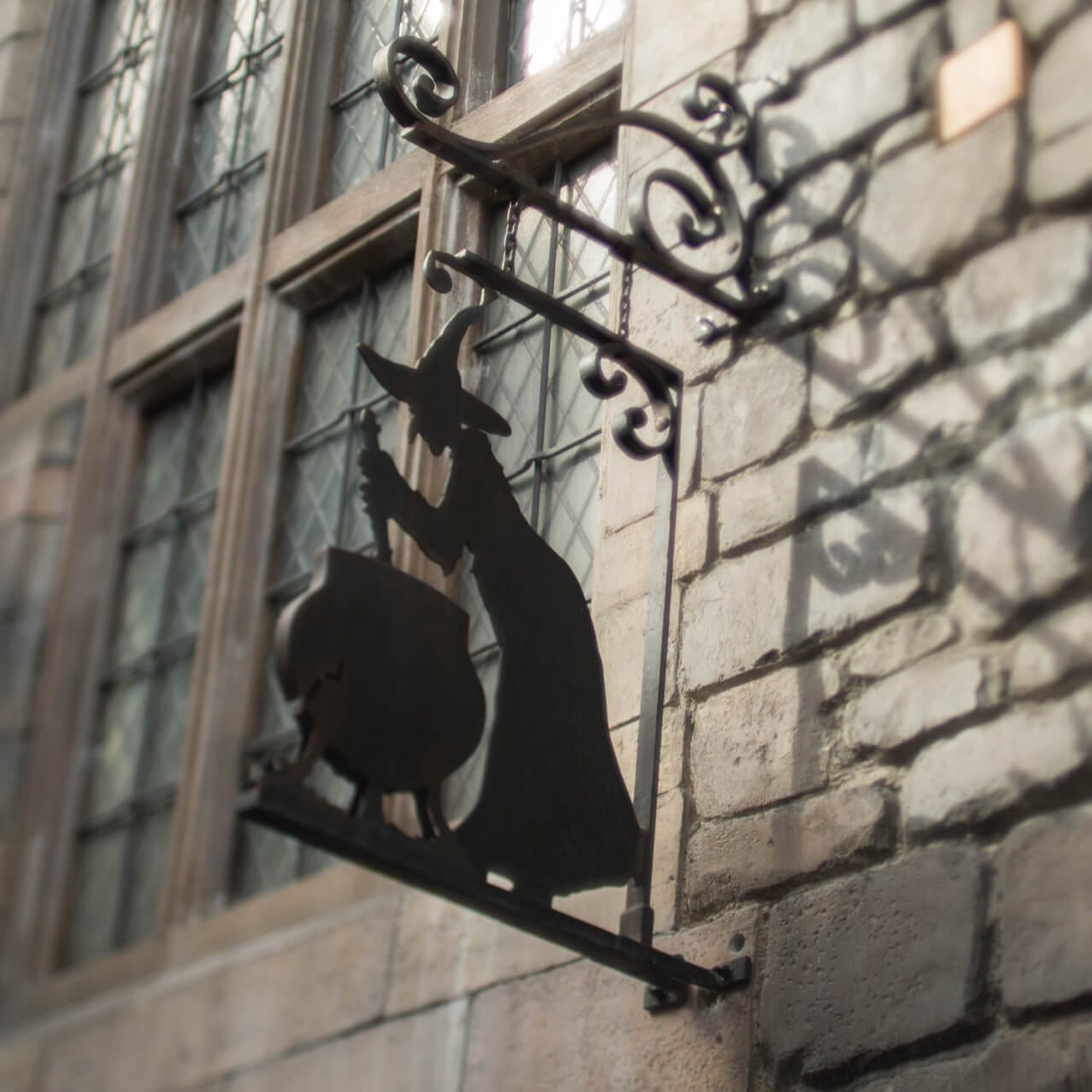 Sign hanging outside the Leaky Cauldron restaurant in The Wizarding World of Harry Potter Diagon Alley at Universal Studios Orlando.