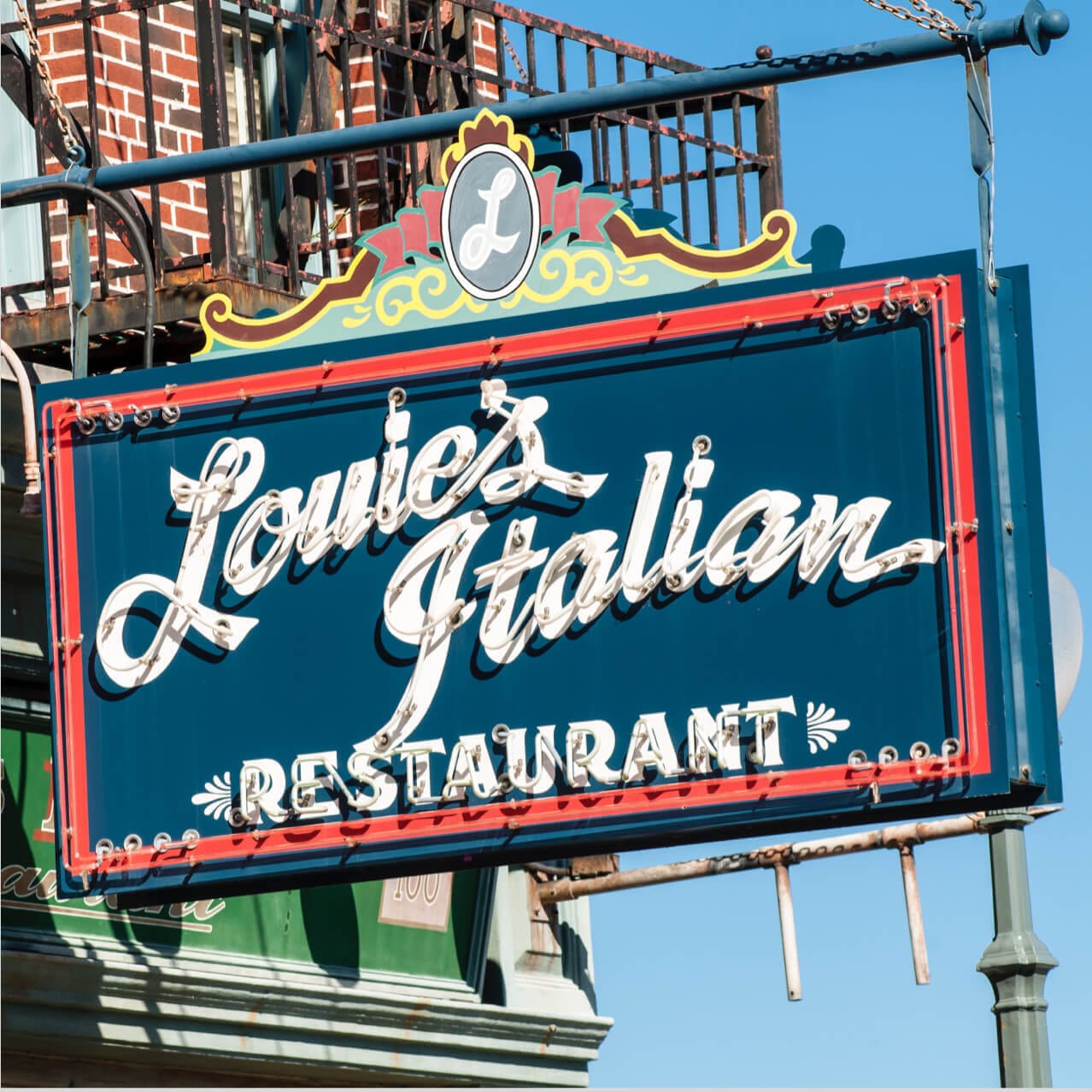 The classic neon sign outside Louie's Italian Restaurant, a quick service eatery in the New York area of Universal Studios Orlando.
