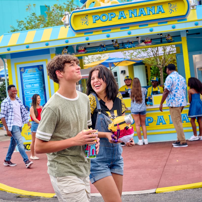 A couple enjoying treats at Pop-A-Nana in Universal Studios Florida.