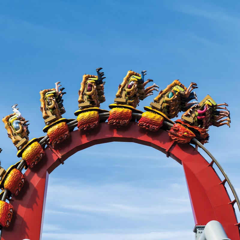 Dragon Challenge loops across the sky.