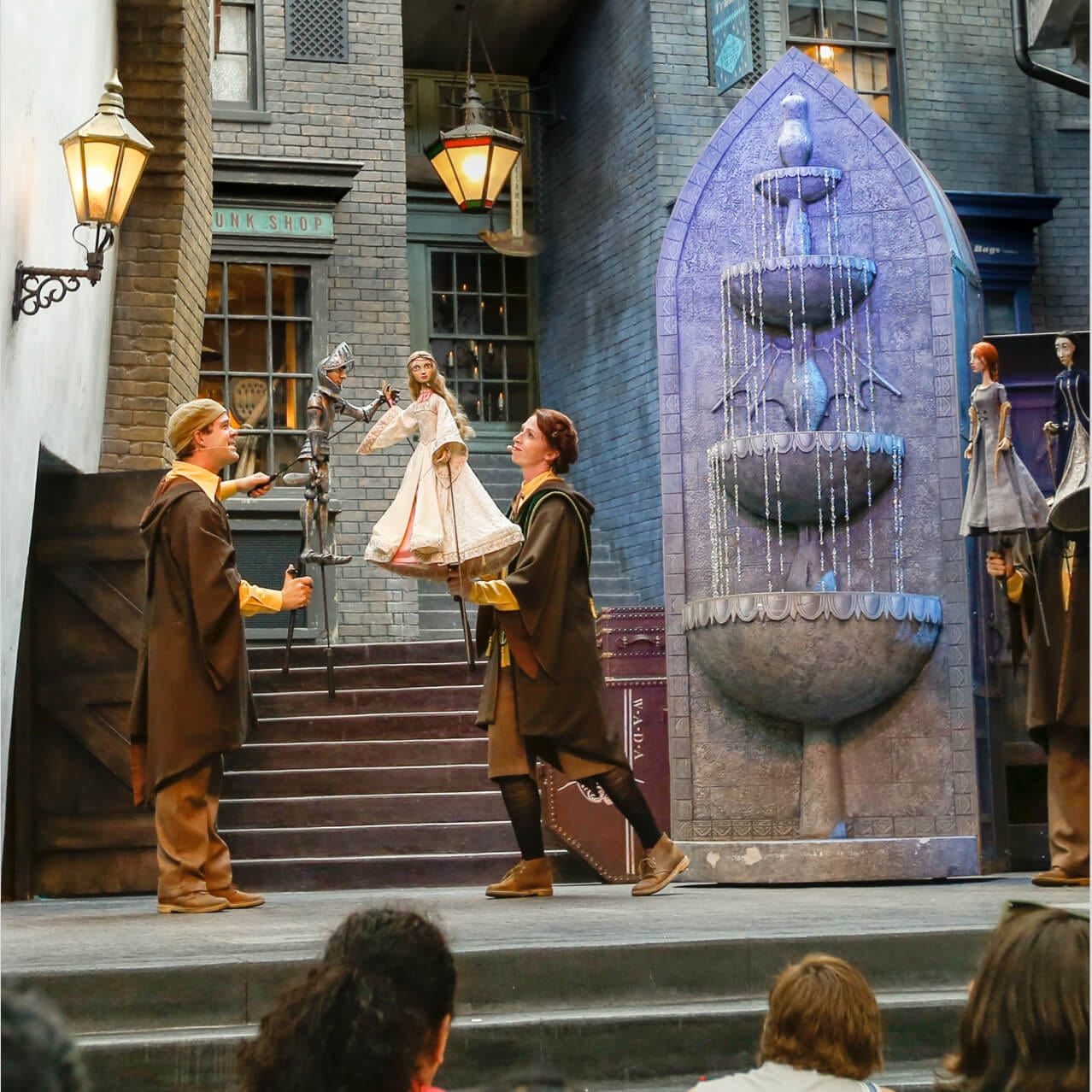 View of the stage scenery, performers and puppets used in the Tales of Beedle the Bard show in The Wizarding World of Harry Potter Diagon Alley at Universal Studios Orlando.