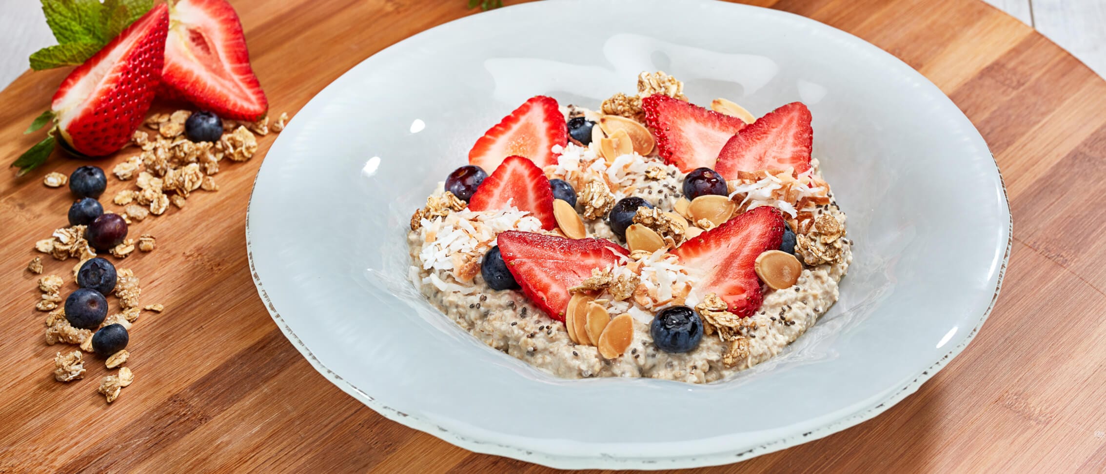 Overnight Oats from TODAY Cafe with seasonal berries, toasted coconut and toasted almonds.