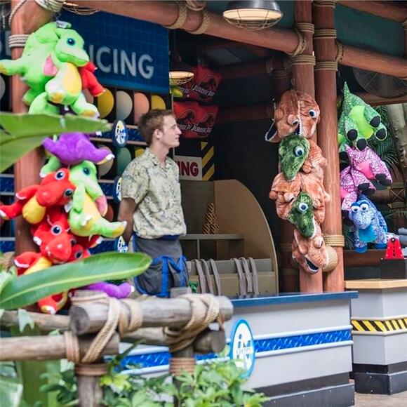 Play carnival games and win prizes at the Jurassic Park Games area of Universal's Islands of Adventure in Orlando. The outdoor area of Jurassic Park Games at Universal Orlando where you can play carnival style games and win fun prizes.