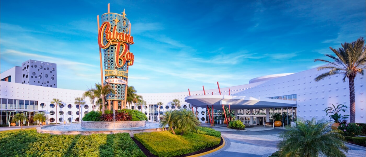 The entrance and exterior of Universal's Cabana Bay Beach Resort, a vibrant and retro-style resort in Orlando.