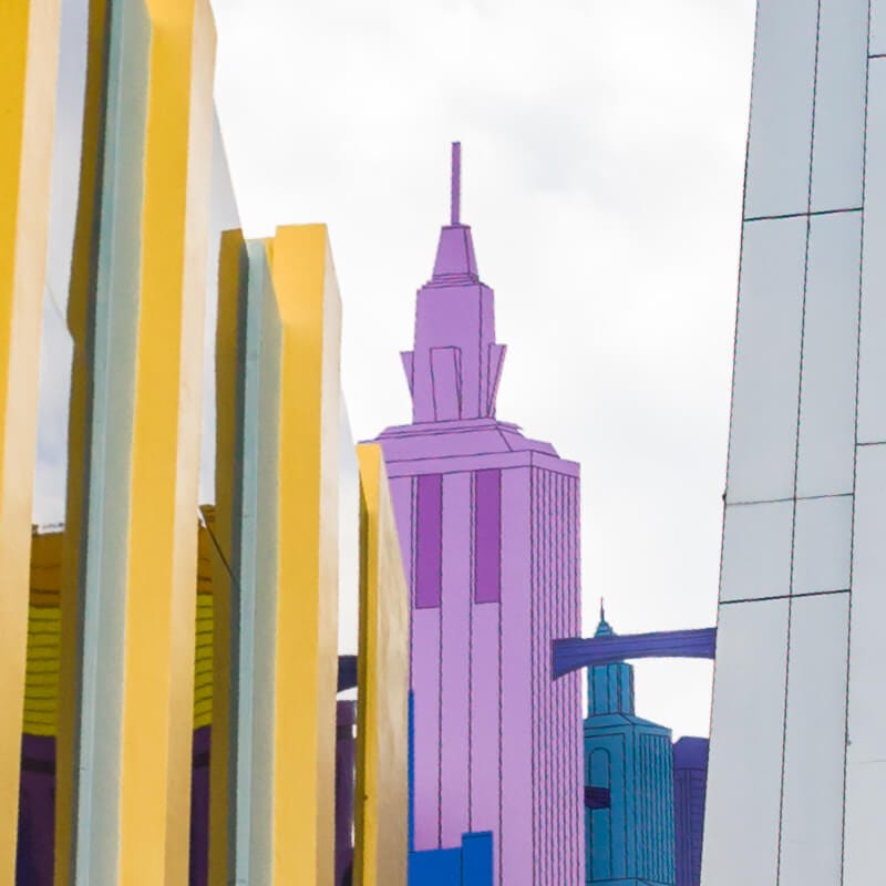 Imagen 1 de datos breves de The Amazing Adventures of Spider Man, que muestra el exterior de los edificios coloridos en Marvel Super Hero Island, en Universal Orlando.