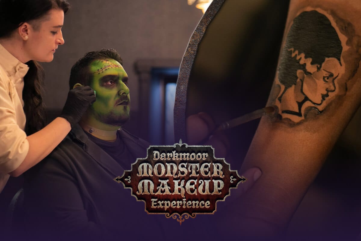 Guest receiving monster makeup and temporary tattoo application at the Darkmoor Monster Makeup Experience.