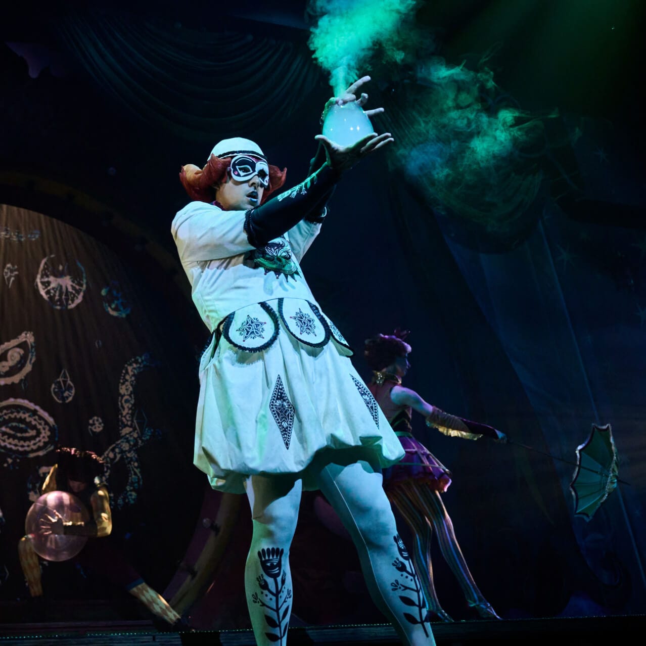 A performer conjures up bubbles filled with smoke on stage at Le Cirque Arcanus™ in The Wizarding World of Harry Potter™ – Ministry of Magic™.