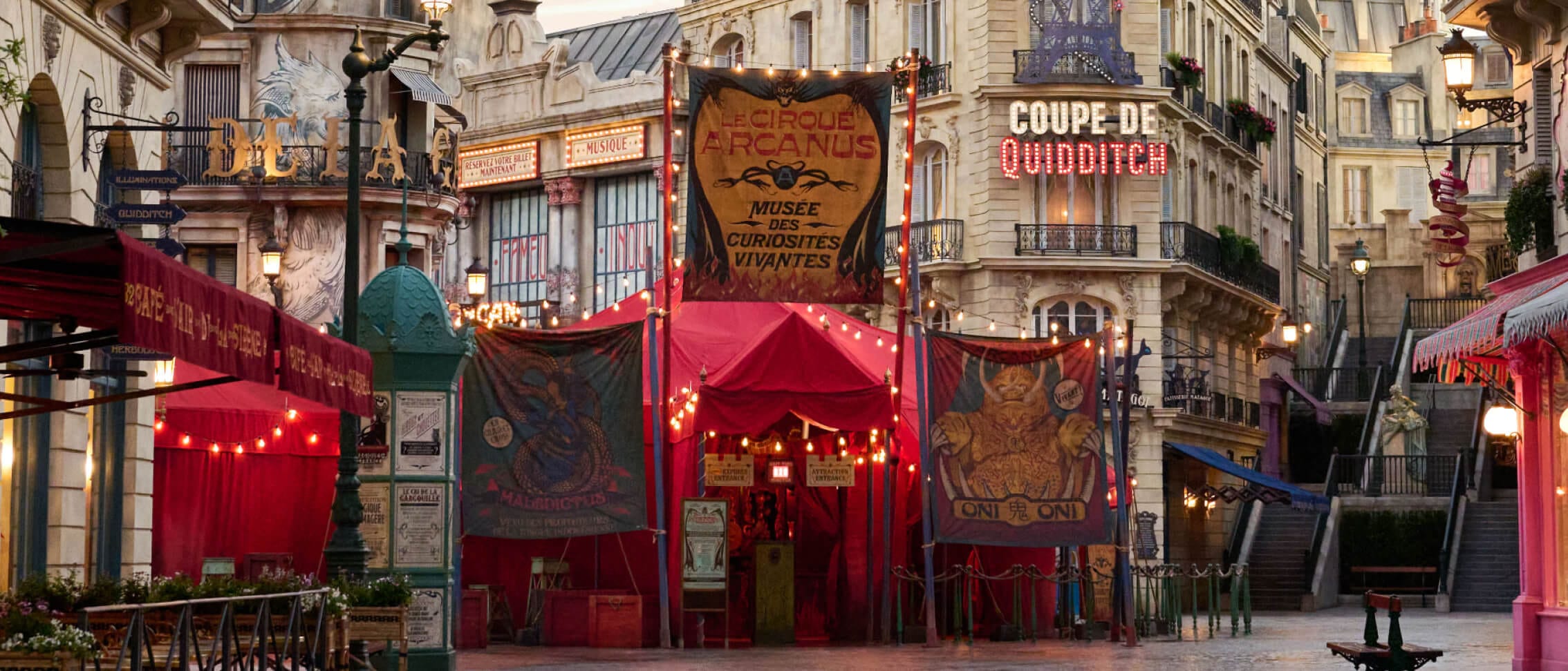 The brightly-lit tent facade entrance of Le Cirque Arcanus in The Wizarding World of Harry Potter™ – Ministry of Magic™