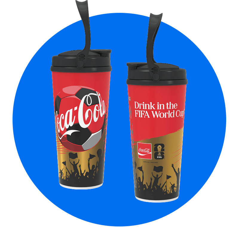 Lidded Coca-Cola Freestyle cups with a soccer ball and crowd design and the words “Drink in the FIFA World Cup” on the side.