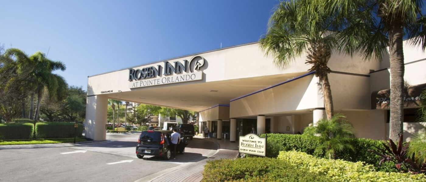 Blue skies above the front entrance of Rosen Inn at Pointe Orlando.
