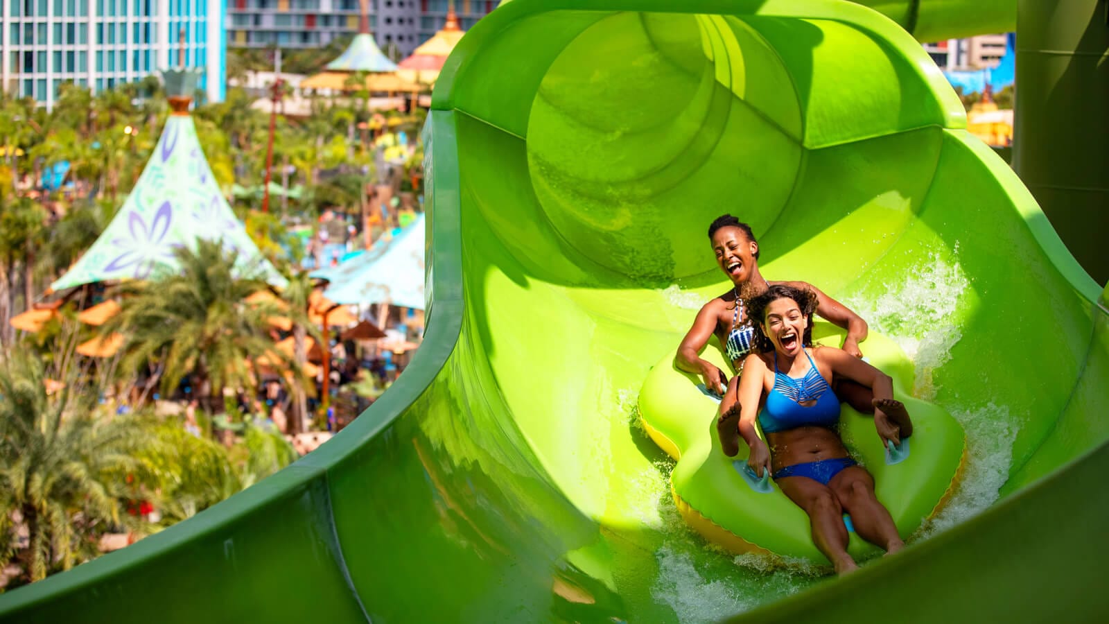 Two women scream while riding the Raki of Taniwha Tubes at Universal Volcano Bay.