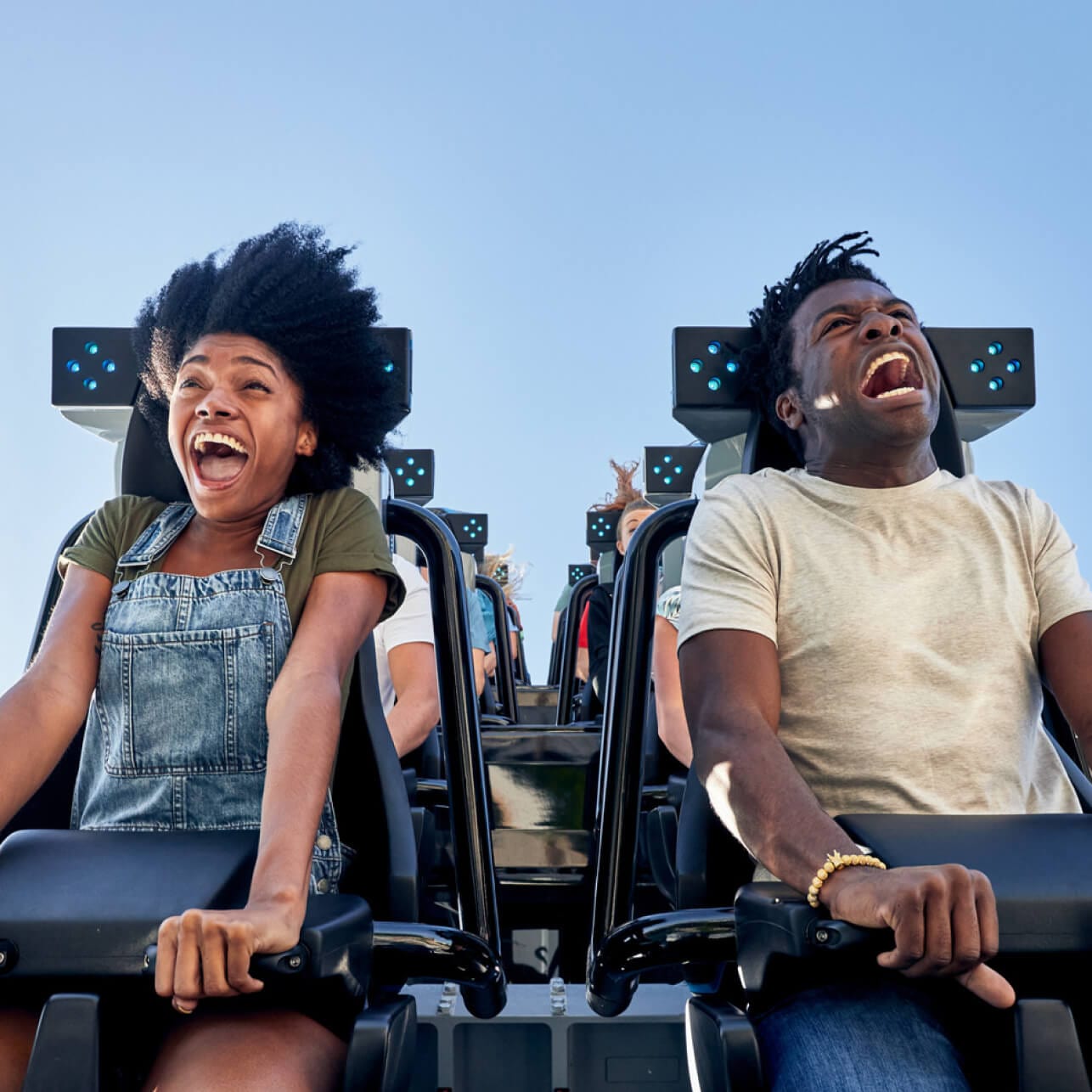 Couple screaming while riding in the very front of the Velocicoaster in the Jurassic Park area at Universals Islands of Adventure