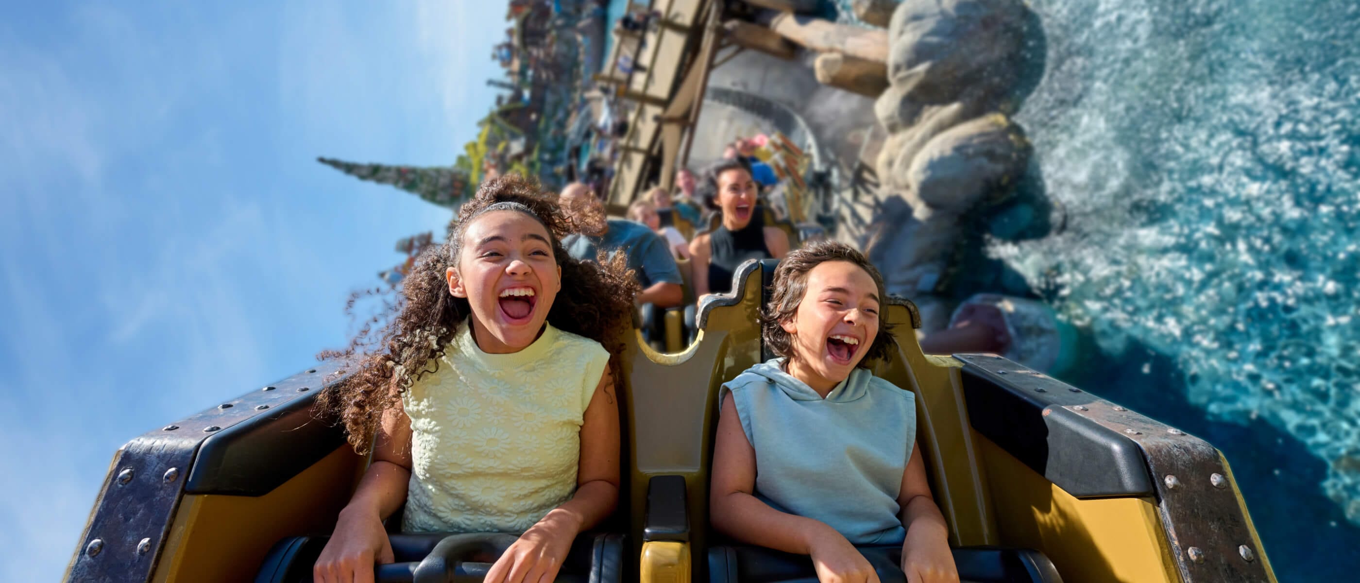 A roller coaster car barrels down the track of The Incredible Hulk Coaster at Universal's Islands of Adventure in Orlando.
