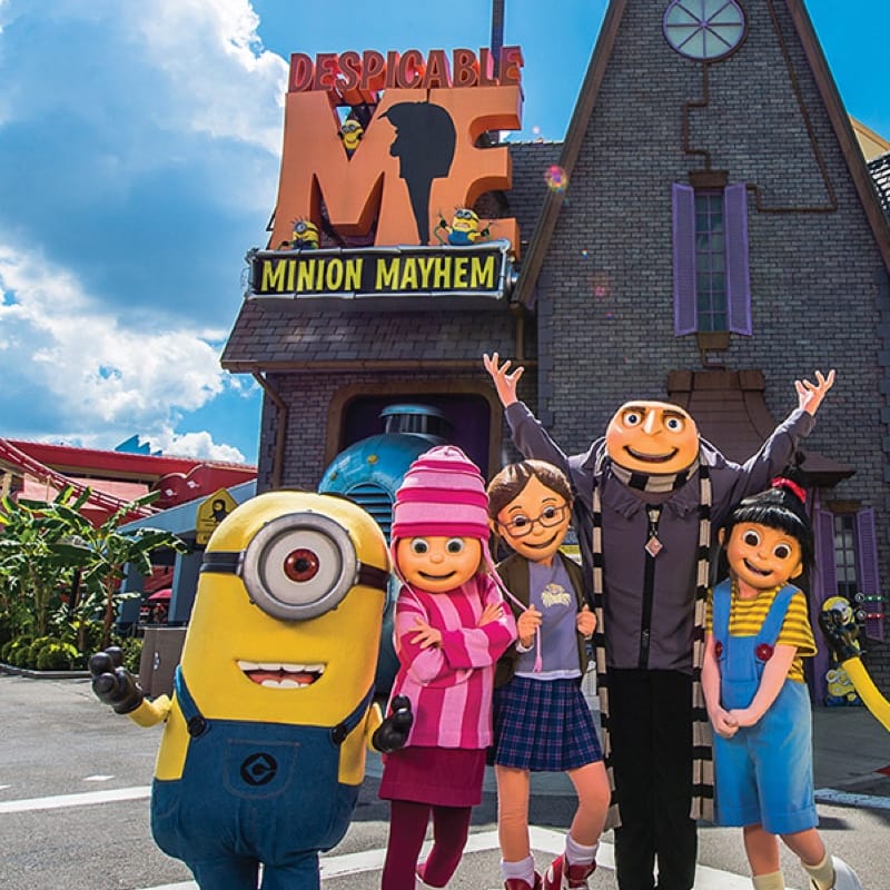 Gru, the Minions and girls outside of Despicable Me Minion Mayhem at Universal Studios Florida.