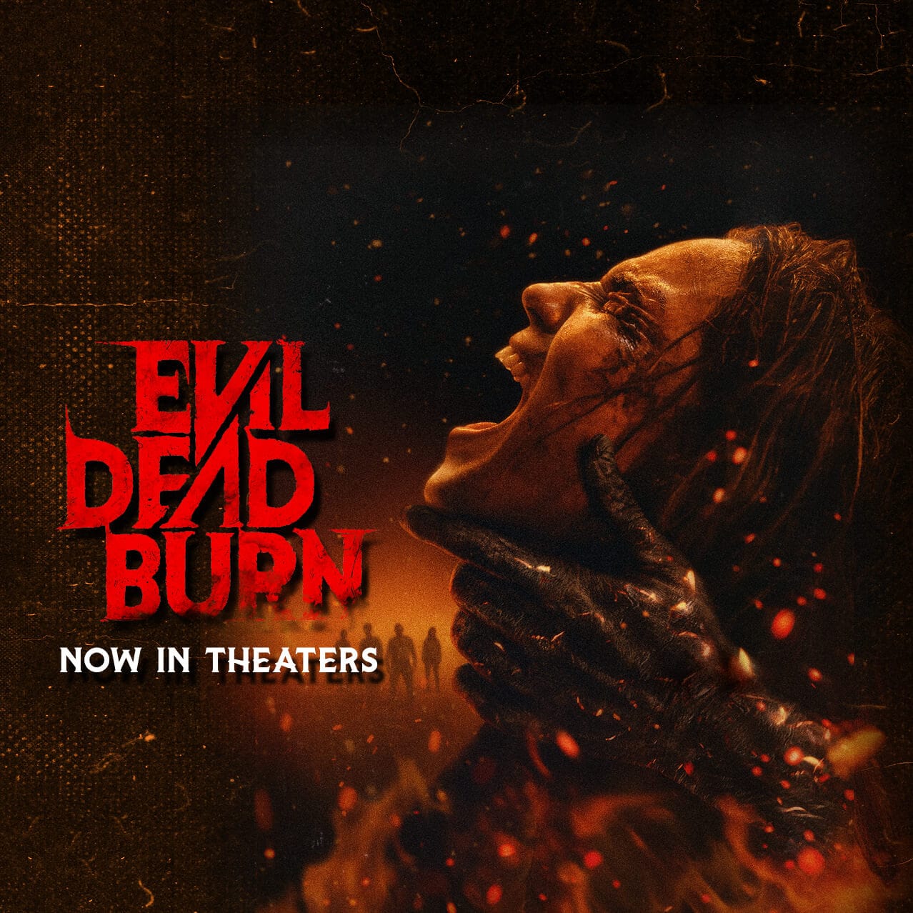 The Evil Dead Burn movie poster with a woman engulfed in flames as hands grip her neck and the text: Now in Theaters.