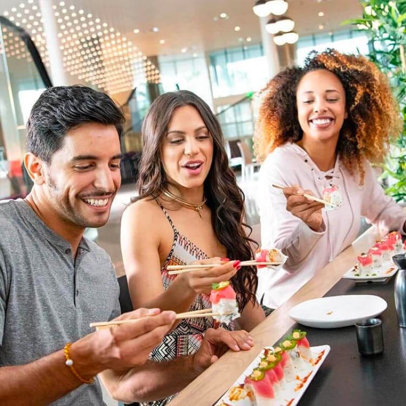Friends enjoying sushi at Urban Pantry at Universal Aventura Hotel