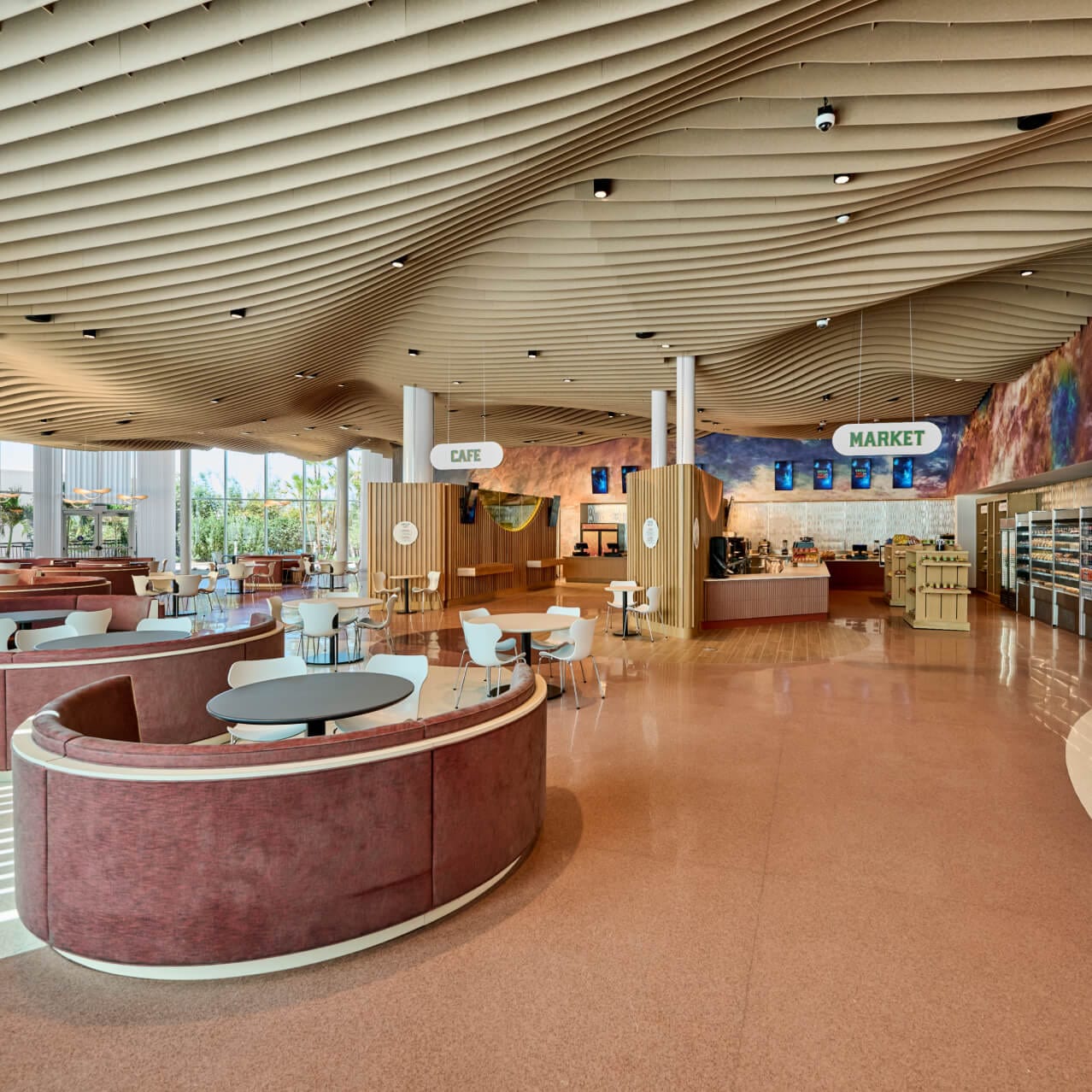 The spacious Omega Cafe and Market area with ample seating and a variety of options for guests of Universal Terra Luna Resort.