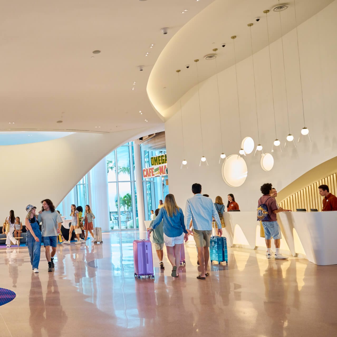 Guests checking in and enjoying the spacious lobby area of Universal Terra Luna Resort.
