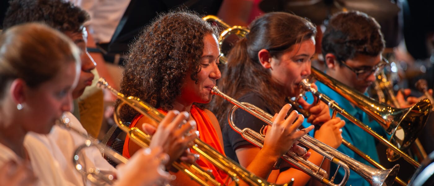 Students playing trumpets in a band