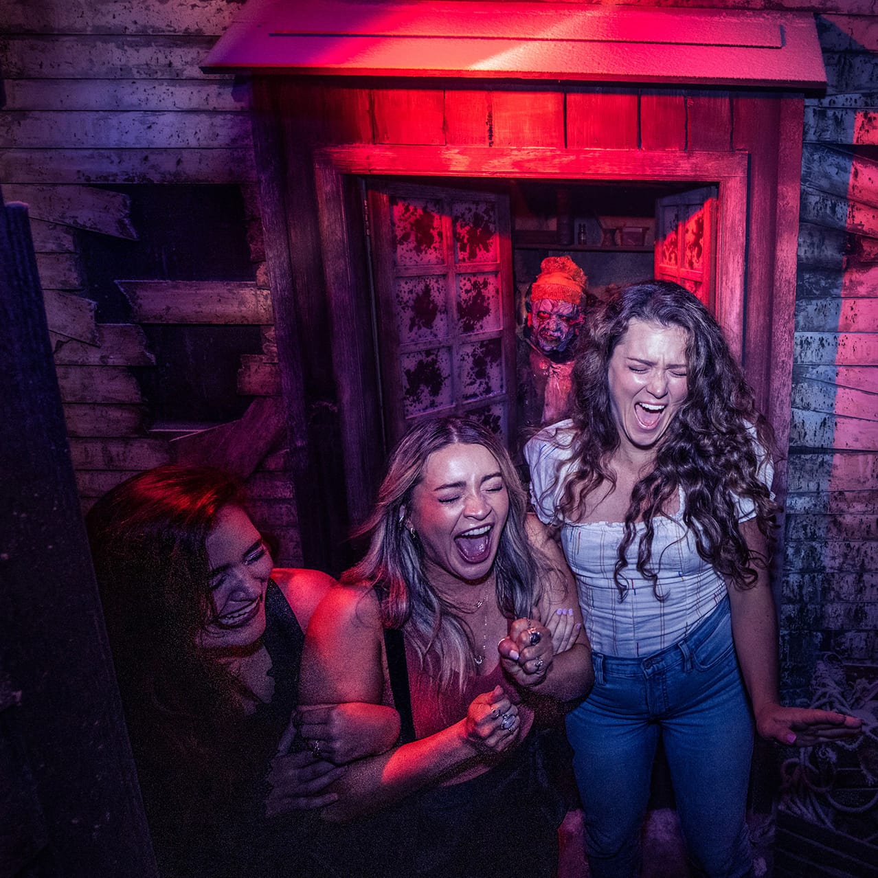  A group of friends being scared at Halloween Horror Nights at Universal Studios Florida.